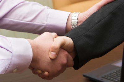 two businessman shaking hands